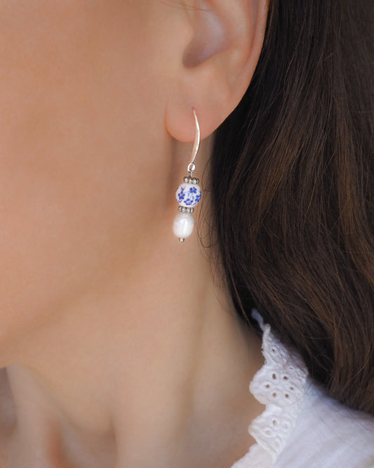Model wearing Portuguese Ceramic Tile Pearl Earrings, Azulejo 925 Sterling Silver Earrings from Portugal, Portuguese Tlles, Blue White Flower Porcelain Earrings