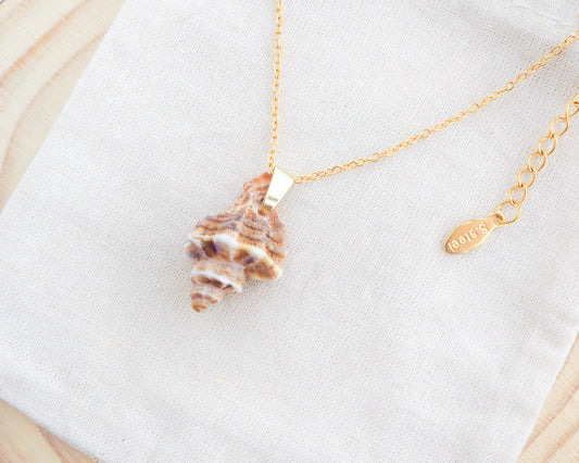 Brown Sting Winkle Gold Necklace side view on display