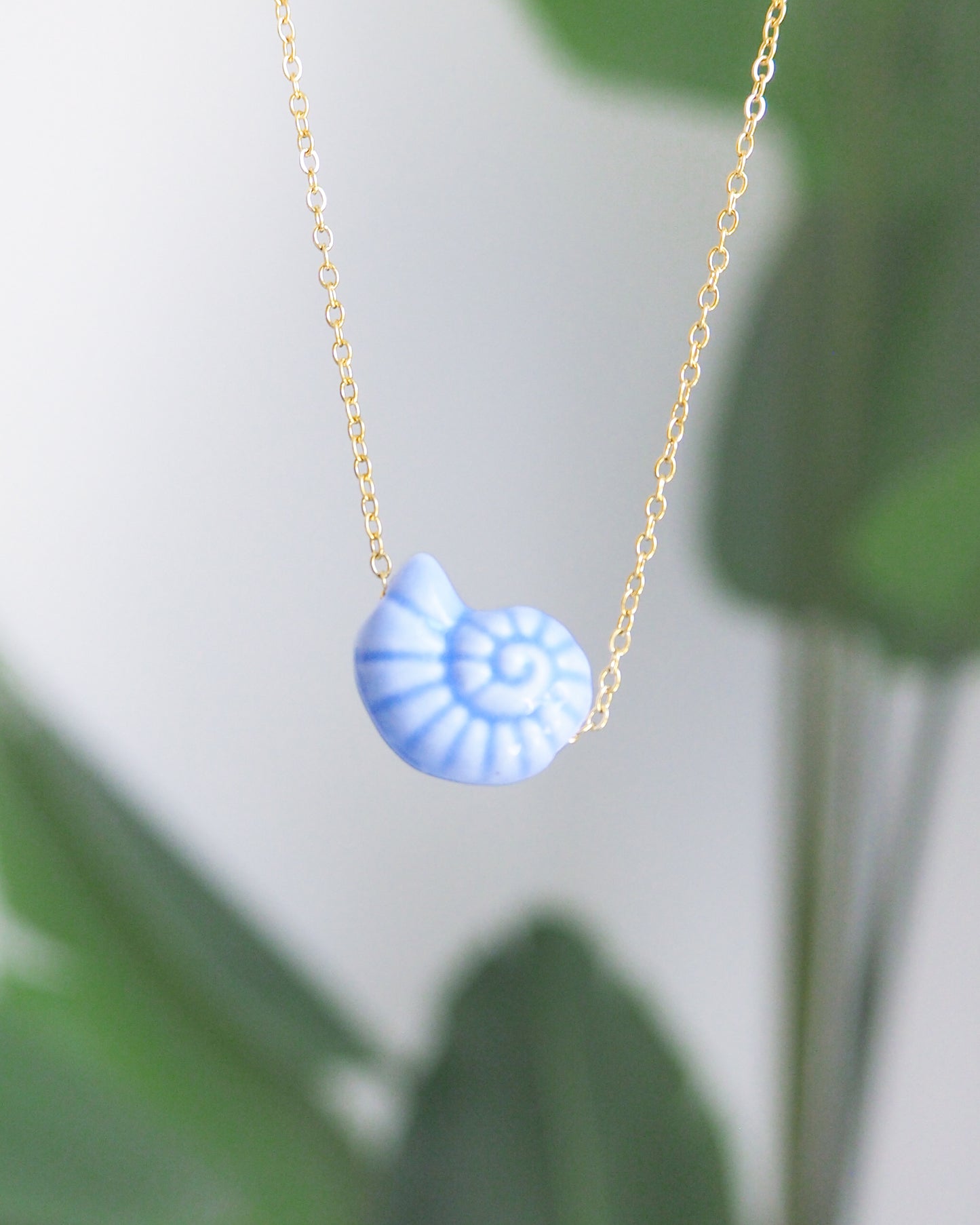 Blue Ceramic Seashell Nautilus Gold Necklace front view
