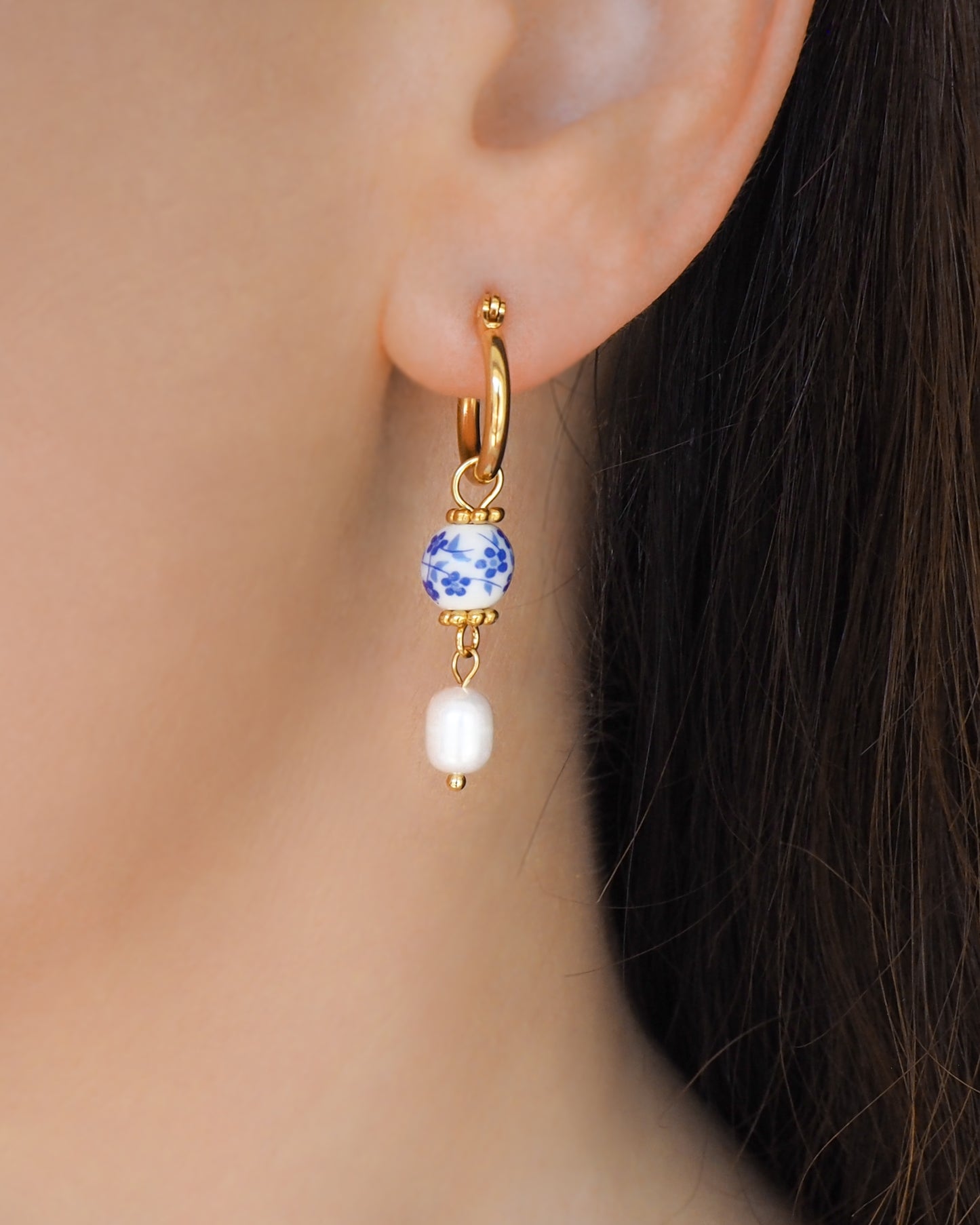 Close up of ear model with Azulejo Pearl Gold Earrings from Portugal, Lisbon Tile Jewelry on model