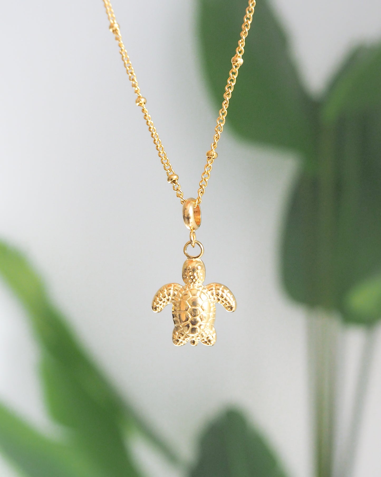Close up of Gold Stainless Steel Turtle Necklace