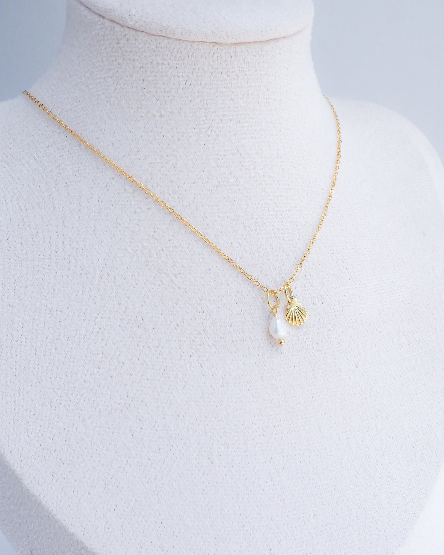 Dainty Gold Shell Pearl Necklace on neck display with freshwater pearls and 18k gold dainty shell pendants