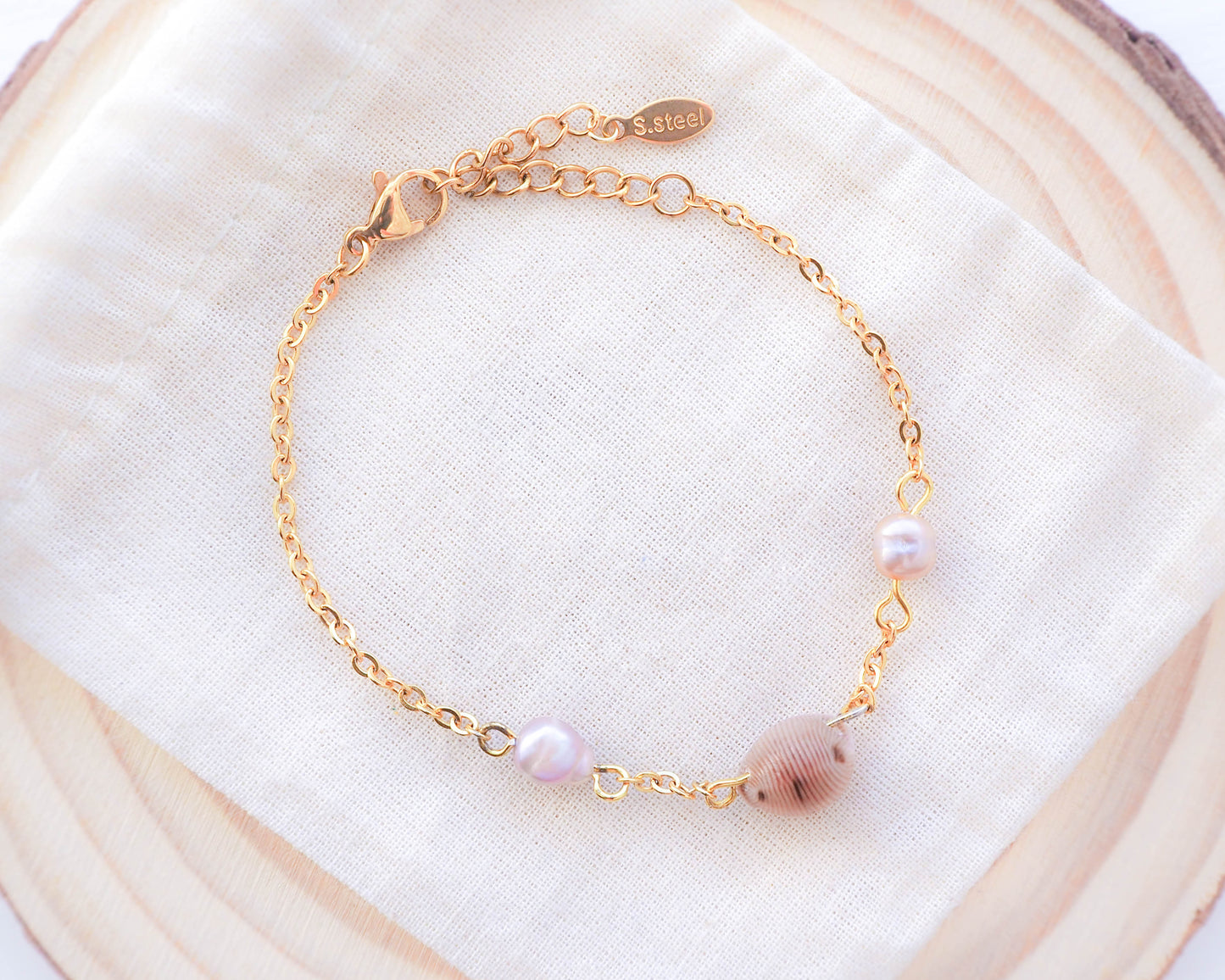 European Cowrie Shell and Freshwater Pearl Gold Bracelet back side on display