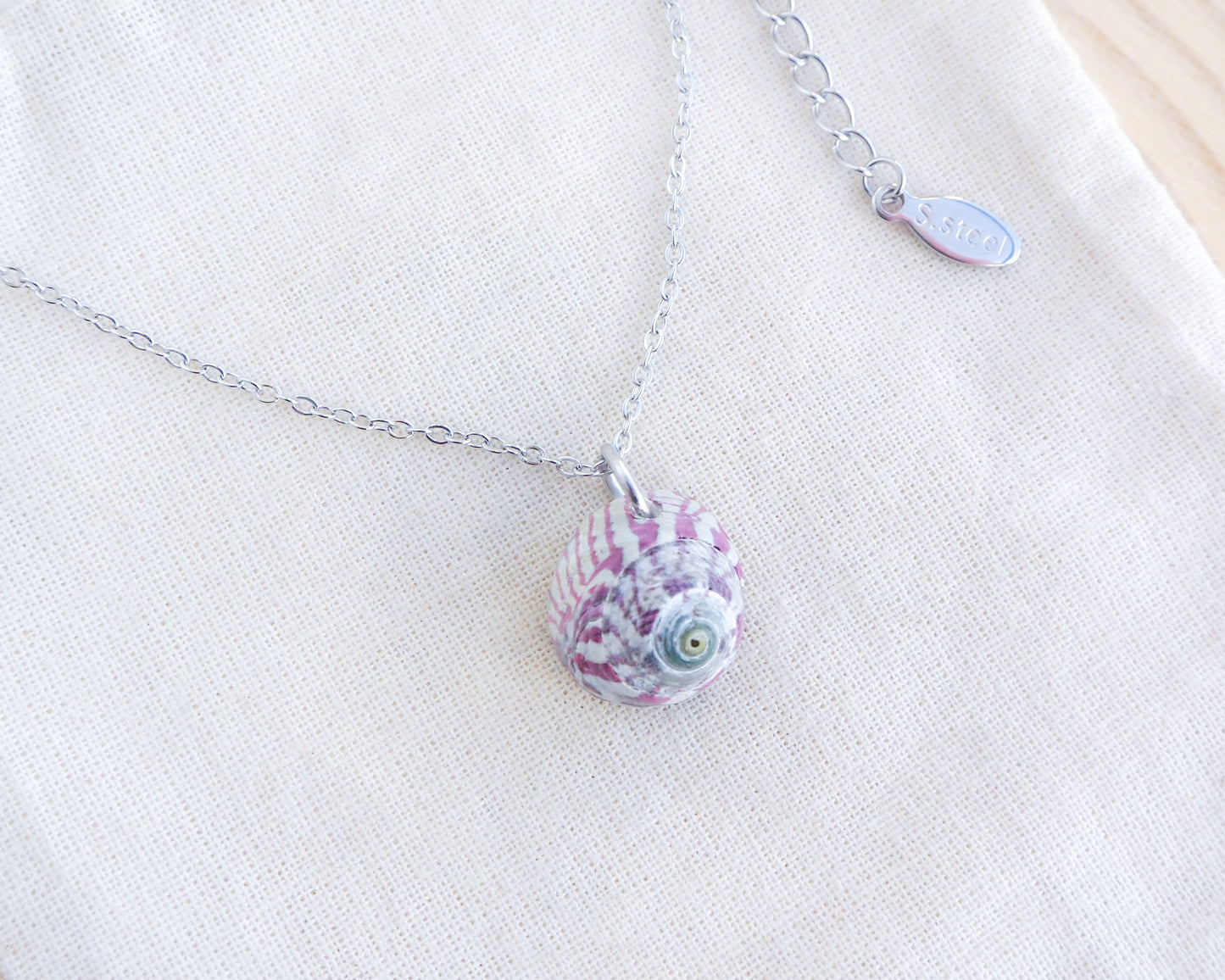 Fuchsia Striped Top Shell Silver Necklace on display