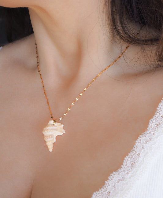 Gold Pelican's Foot Shell Necklace Deluxe on neck model