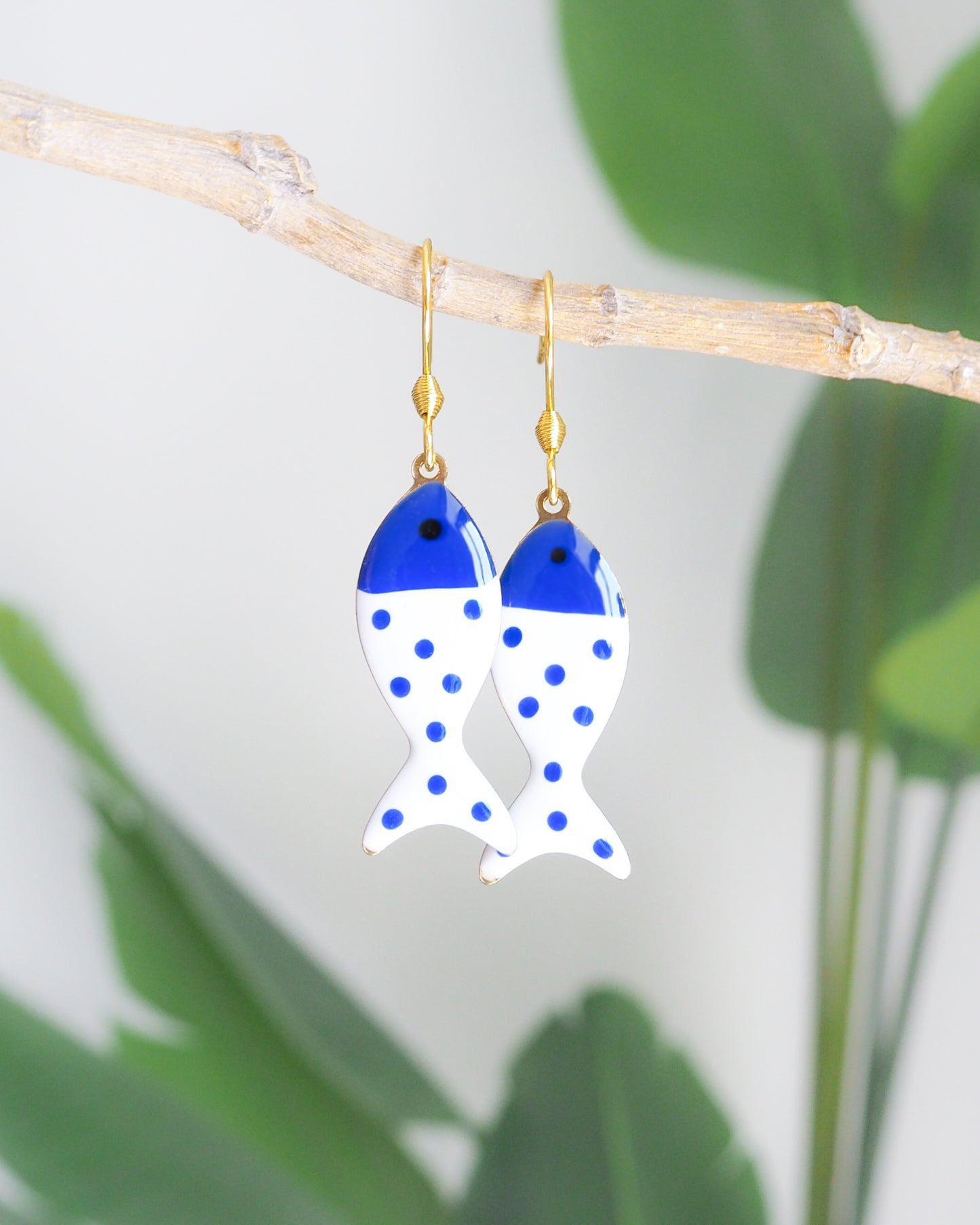 Front view of White Blue Polka Dot Sardine Fish Earrings, 14k gold stainless steel earring hooks, summer drop earrings from Portugal