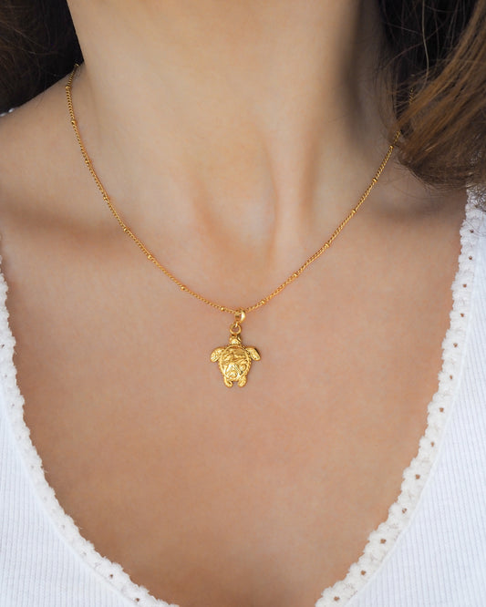 Gold Big Sea Turtle Necklace on model