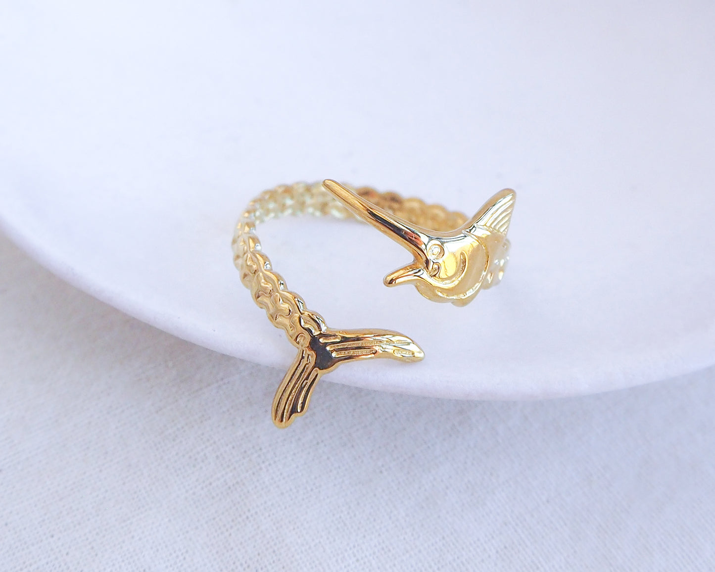 Gold Swordfish Ring on display close up