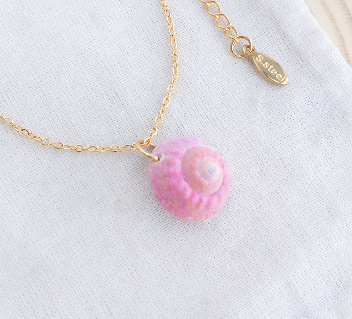 Tiny Pink Shell Necklace with gold necklace, Pink Magus Top Shell from Portugal on display