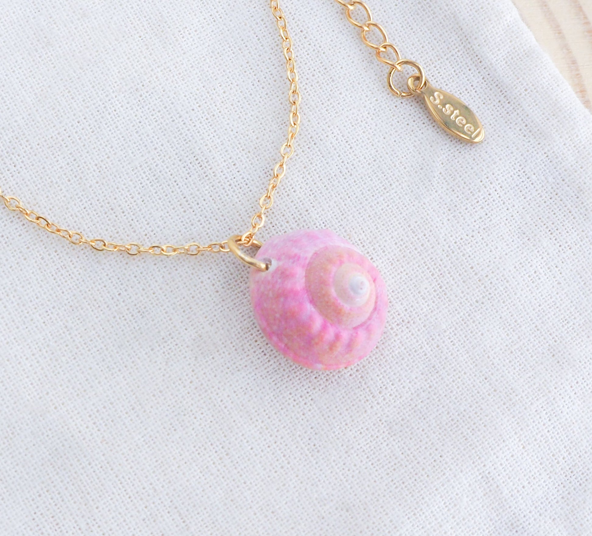 Tiny Pink Shell Necklace with gold necklace, Pink Magus Top Shell from Portugal on display