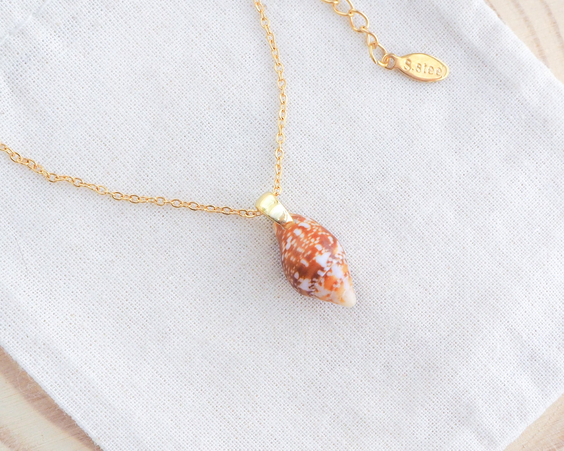 Tiny Rustic Dove Shell Gold Necklace, Tiny shell from Portugal on display