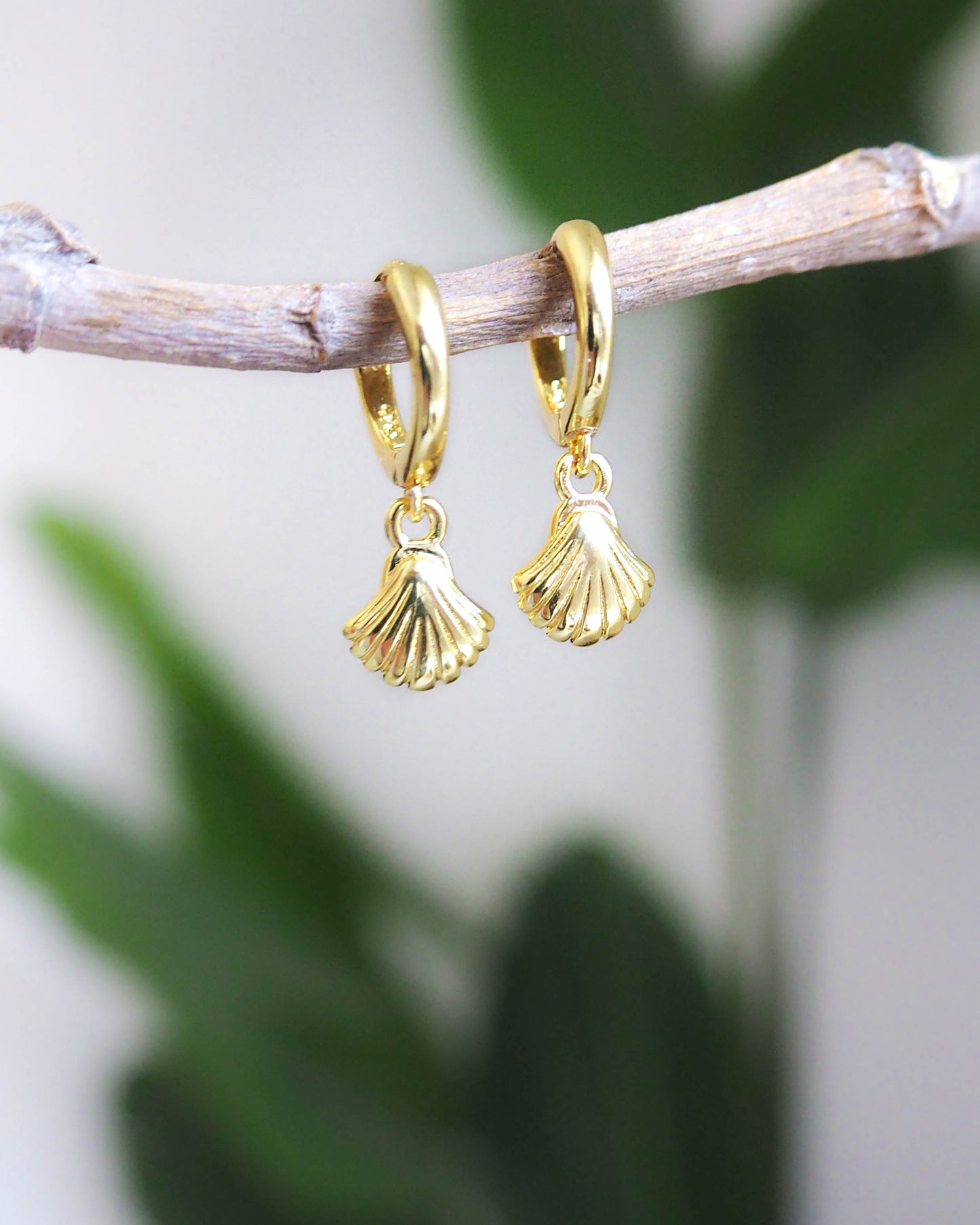 Front view of Gold Tiny Seashell Huggie Earrings, 14k gold vermeil or 925 Sterling Silver, Dainty Tiny Scallop Shell Pendant Hoop Earrings, Sea by Lou jewelry, Minimalistic Coastal Style