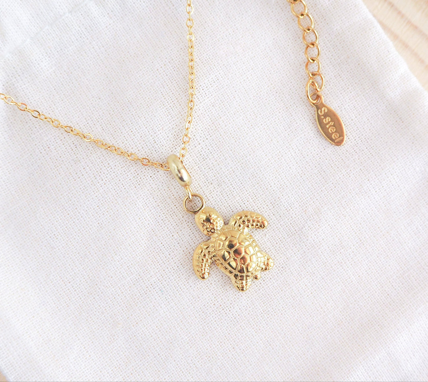 Gold Turtle Necklace on display, Baby Turtle Necklace