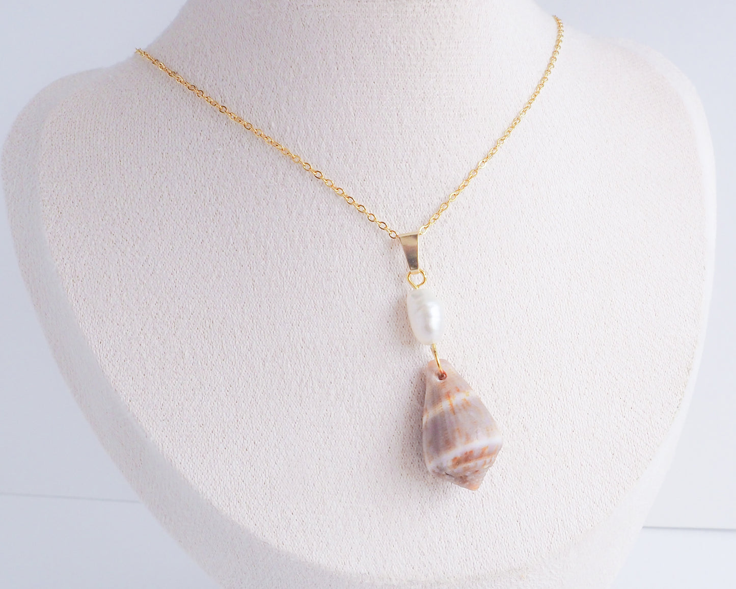 Ivory Pearl with Cone Shell Gold Necklace on neck displayed