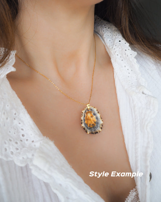 Gold Limpet Shell Necklace with orange center on neck model. Limpet Shell from Portugal, Lapa Concha