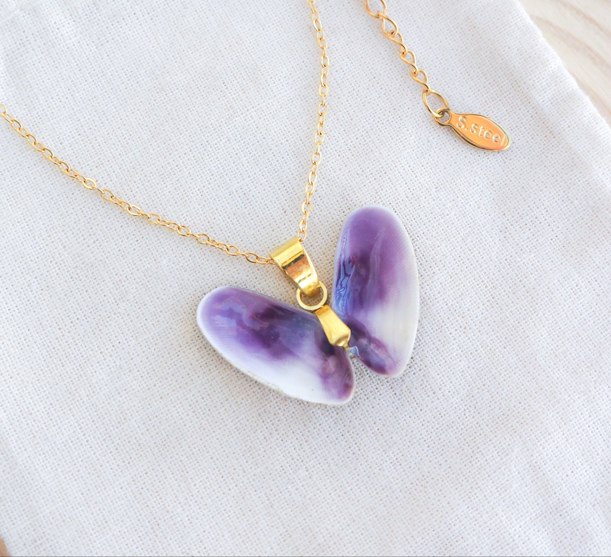 Lovely Donax Shell Necklace on display, Gold Necklace with Purple Coquina Shells from Portugal on display