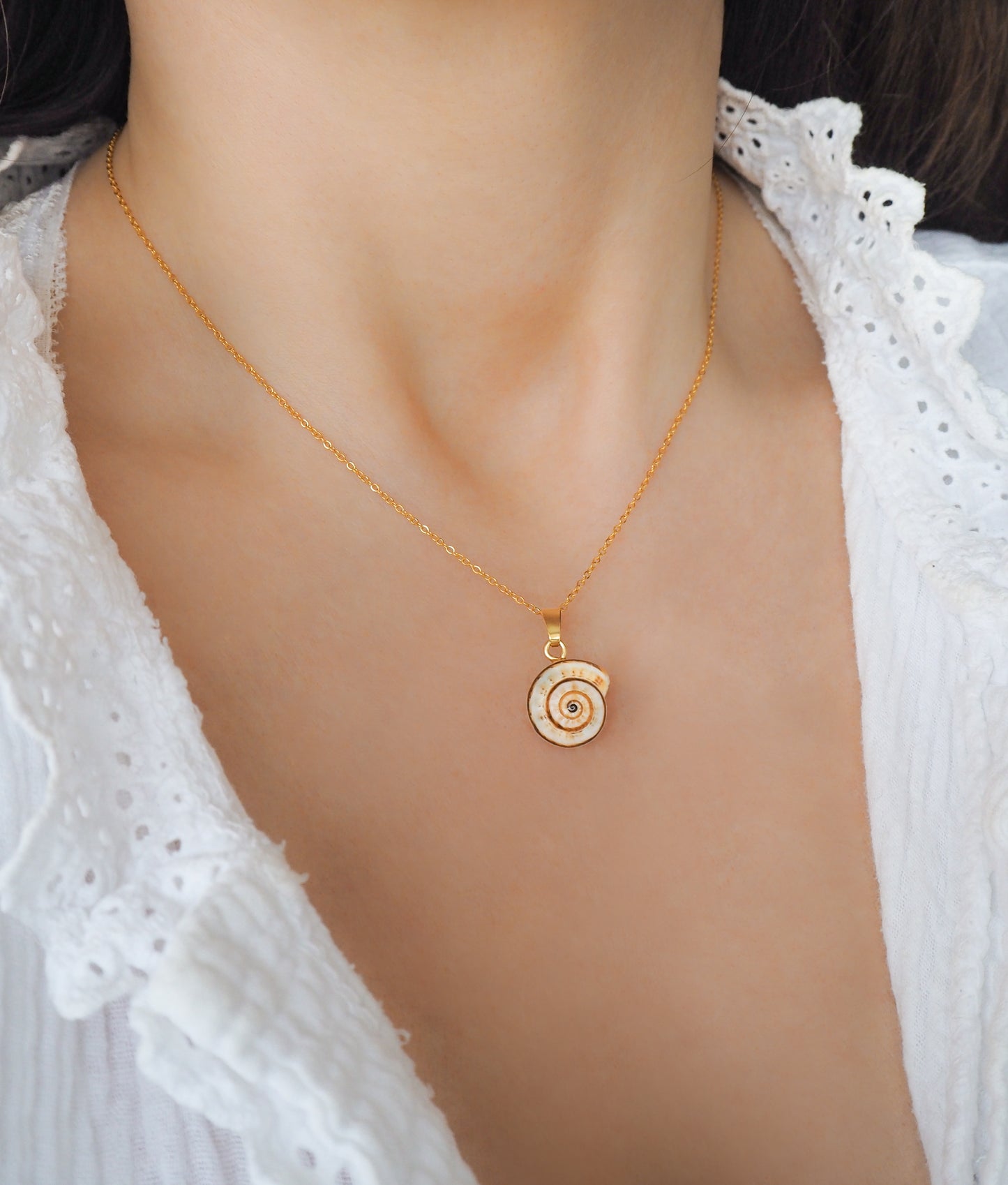 Gold Caracol Necklace, Mediterranean Coastal Snail Necklace, Caracol, Sand Snail on display