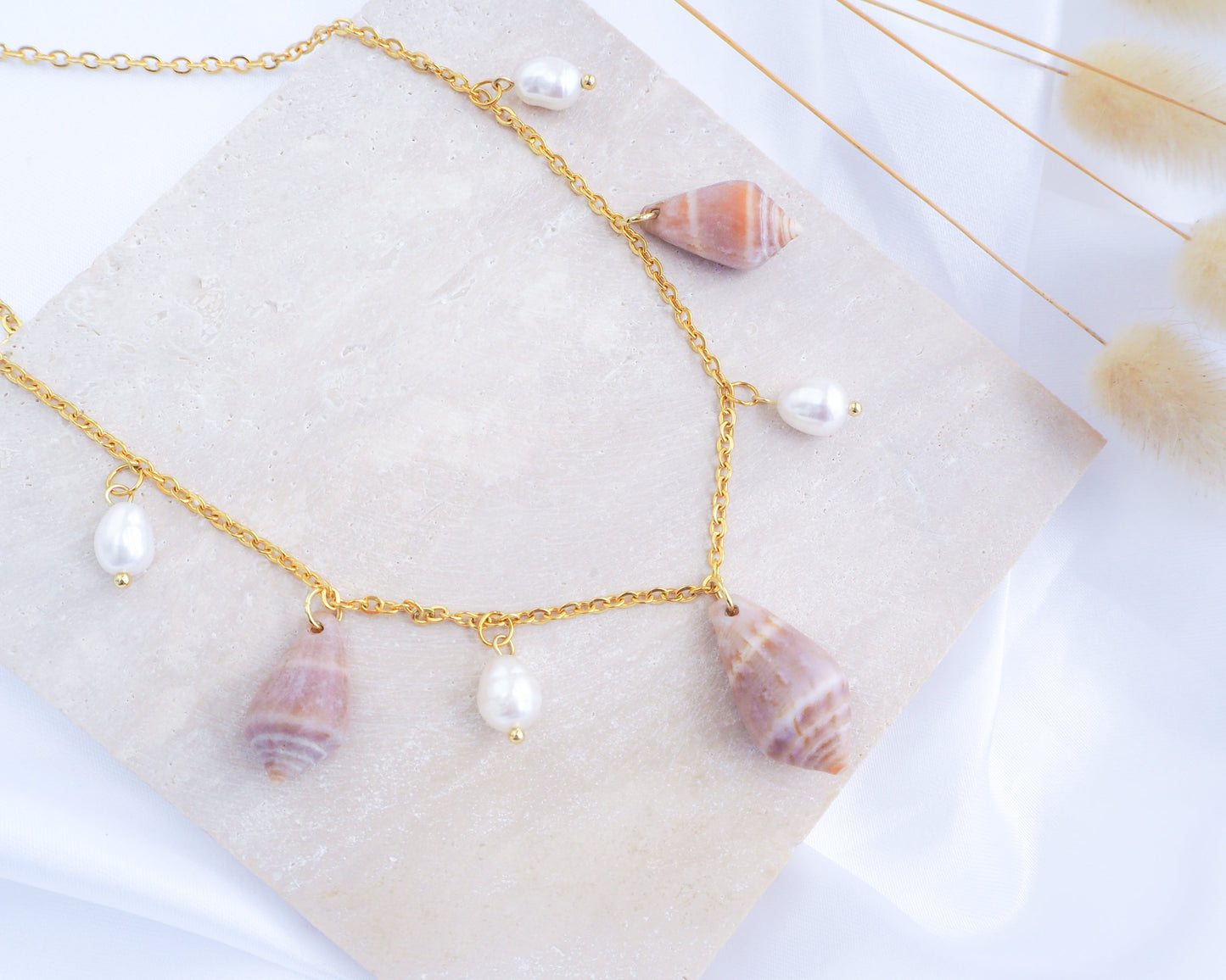 Mediterranean Cone Shell with Pearl Charm Necklace on display, Cone Shells from Portugal