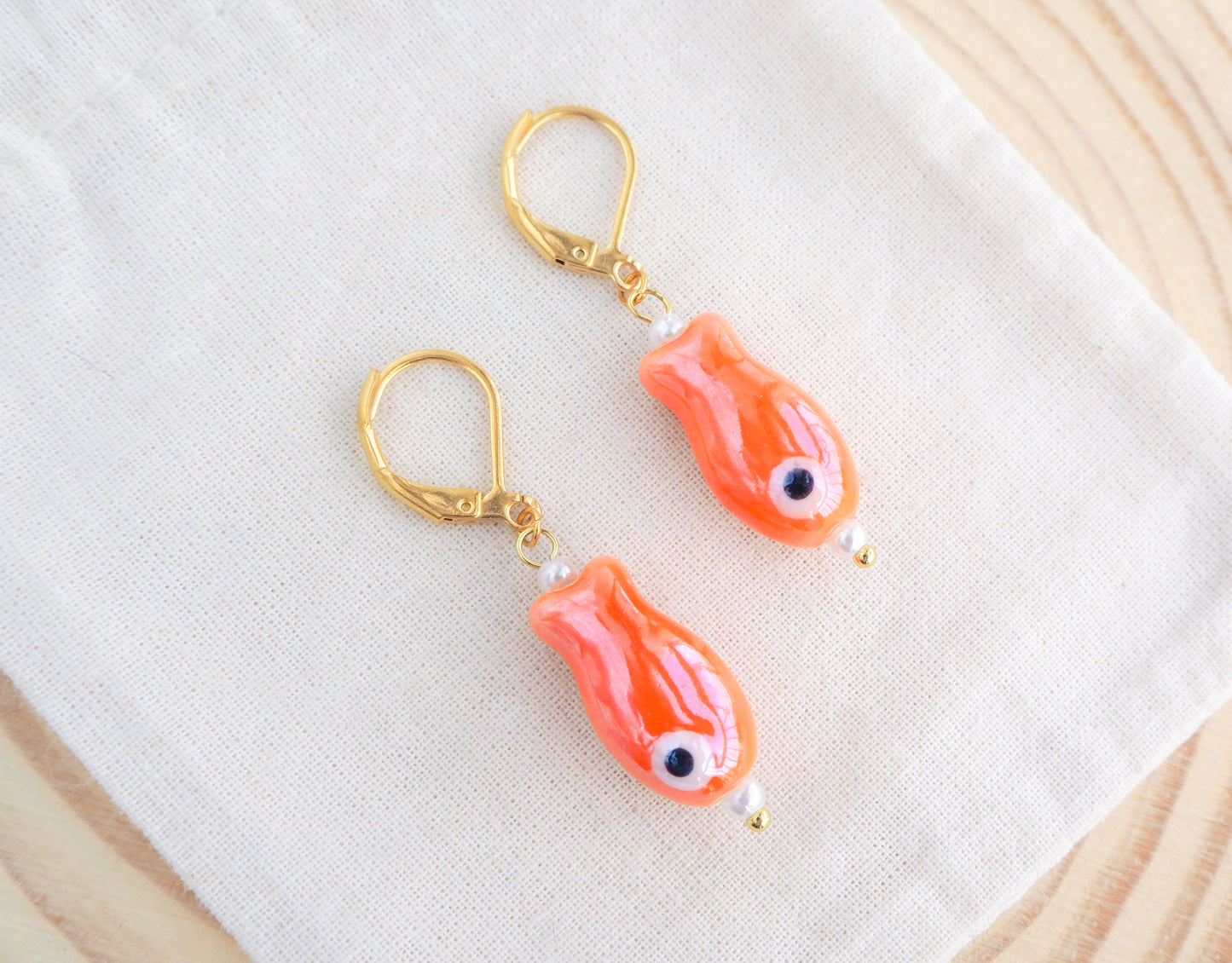 Orange Ceramic Fish Gold Earrings on display, Ceramic Orange Fish, Summer Earrings