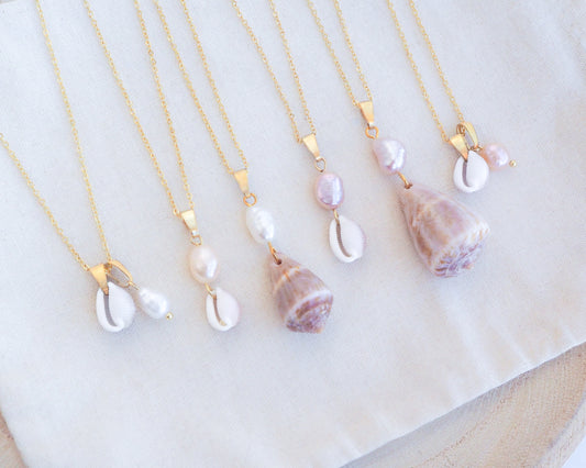 Pearl Cone Shell and Cowrie Shell Pearl Necklaces from Portugal on display