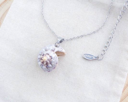 Pearly Magus Top Shell Silver Necklace on display