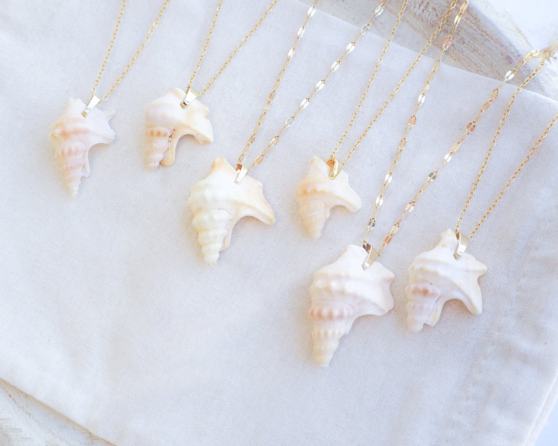 Side view of Pelican Foot Shell Gold Necklaces from Portugal