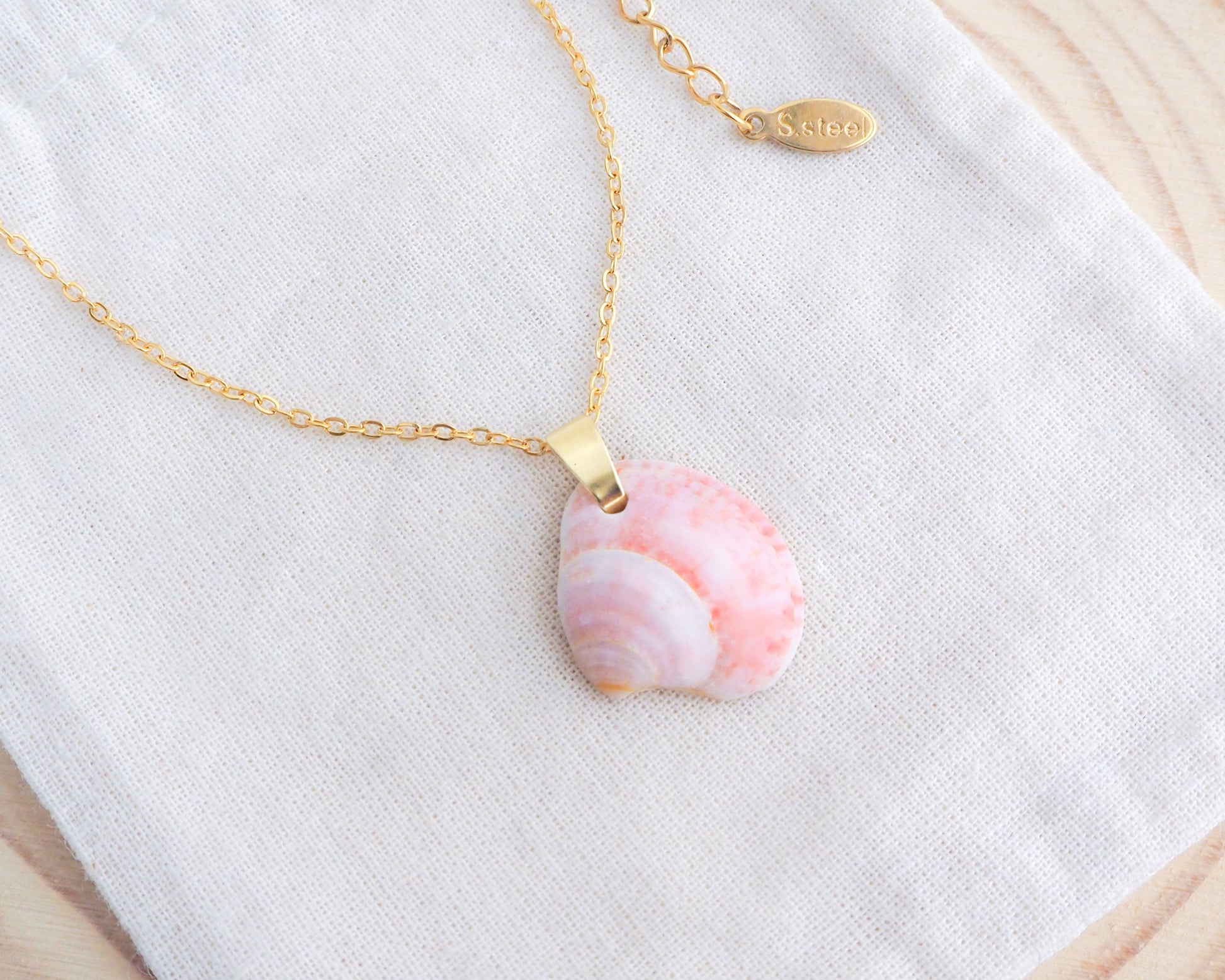Pink Venus Shell Gold Necklace III on display