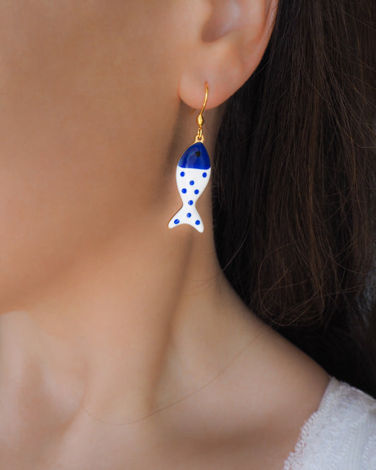 Model wearing White Blue Polka Dot Sardine Fish Earrings, 14k gold stainless steel earring hooks, summer drop earrings from Portugal