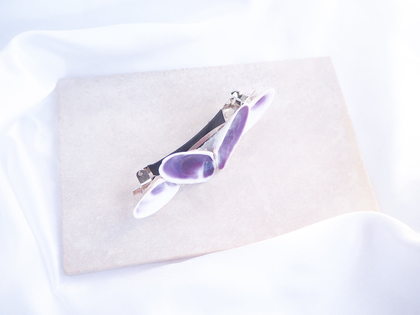 Front view of Purple Coquina Shells Butterfly Hair Clip Barrette on stone displayed, Purple Shells from Portugal, Handpicked Real Coquina Shells, Sea Butterfly Shell Hair Decoration, Seashell Wedding Hair accessories, Coastal Christmas gift, Beach Wedding Hair