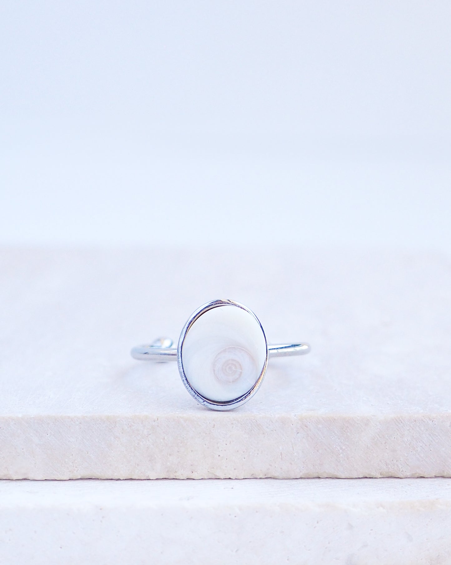 SEASHELL RING ~ Tiny Ivory White Eye of Saint Lucia Silver Bezel