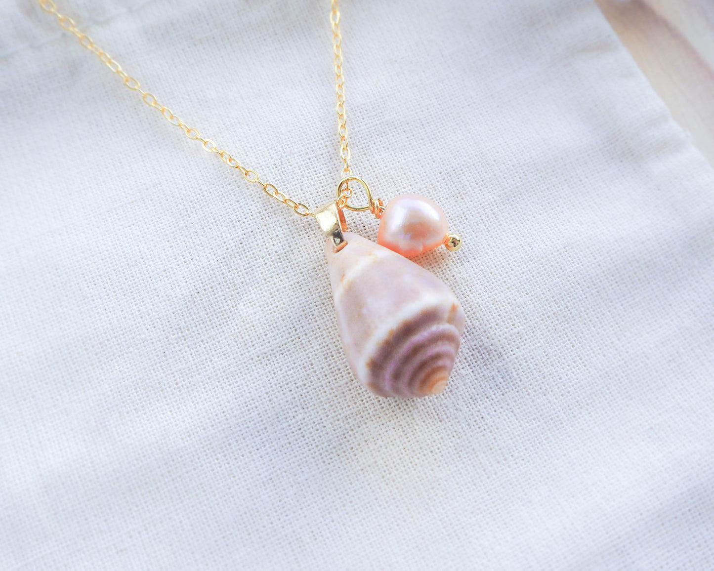 Close-up of Pendant: Freshwater Pearl and Cone Shell on 925 Silver & 18K Gold-Plated Necklace