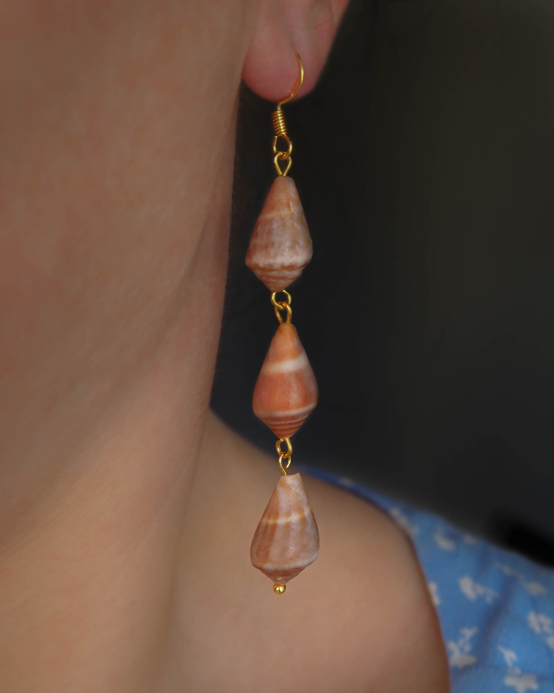 Model wearing Tripe Cone Shell Drop Dangle Gold Earrings