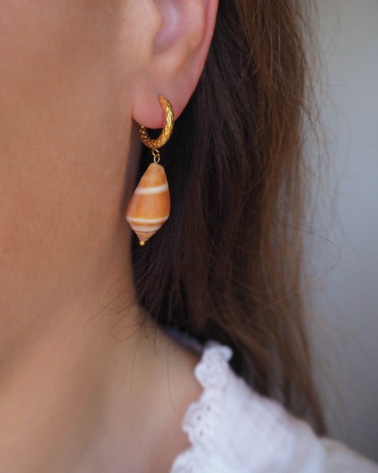 Model wearing Mediterranean Cone Shell Earrings with Gold Loop Hooks – Ocean Inspired Jewelry