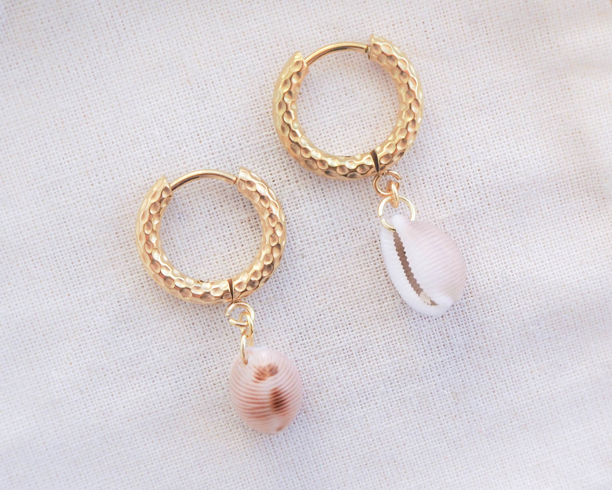 Close-up of European Cowrie Jewelry: Unique Gold Earrings, Handcrafted from Portugal