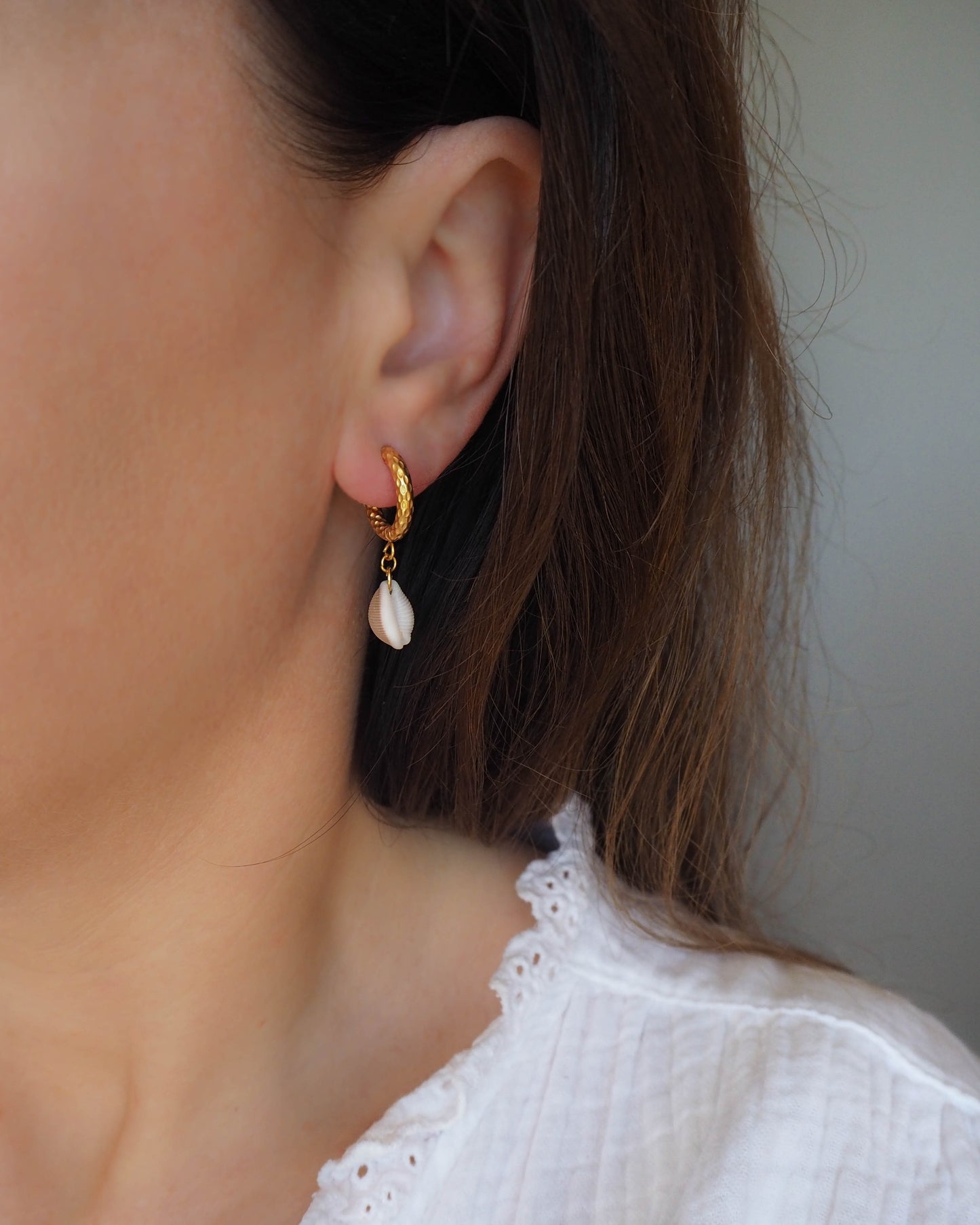 Model wearing Cowrie Shell Earrings with Gold Hooks – Seaside Chic Jewellery, Sea by Lou, Portuguese Coastal Jewelry