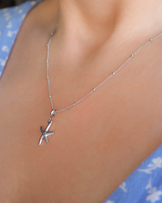 Model wearing Silver Starfish Sea Star Necklace, Seabylou, Hypoallergenic Stainless Steel Bead Chain, Ocean Inspired Jewelry, beach girl
