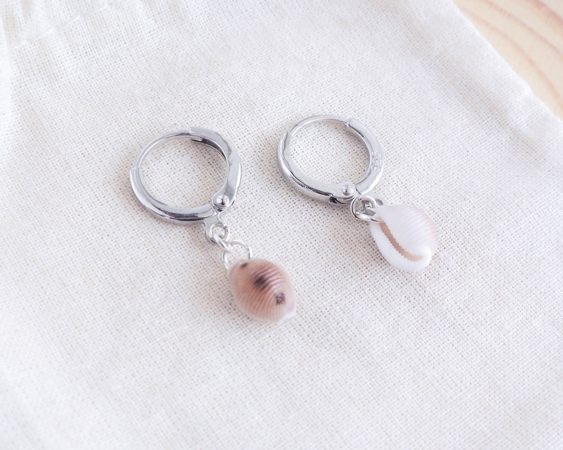 Silver Earrings with Cowrie Shells from Portugal on display