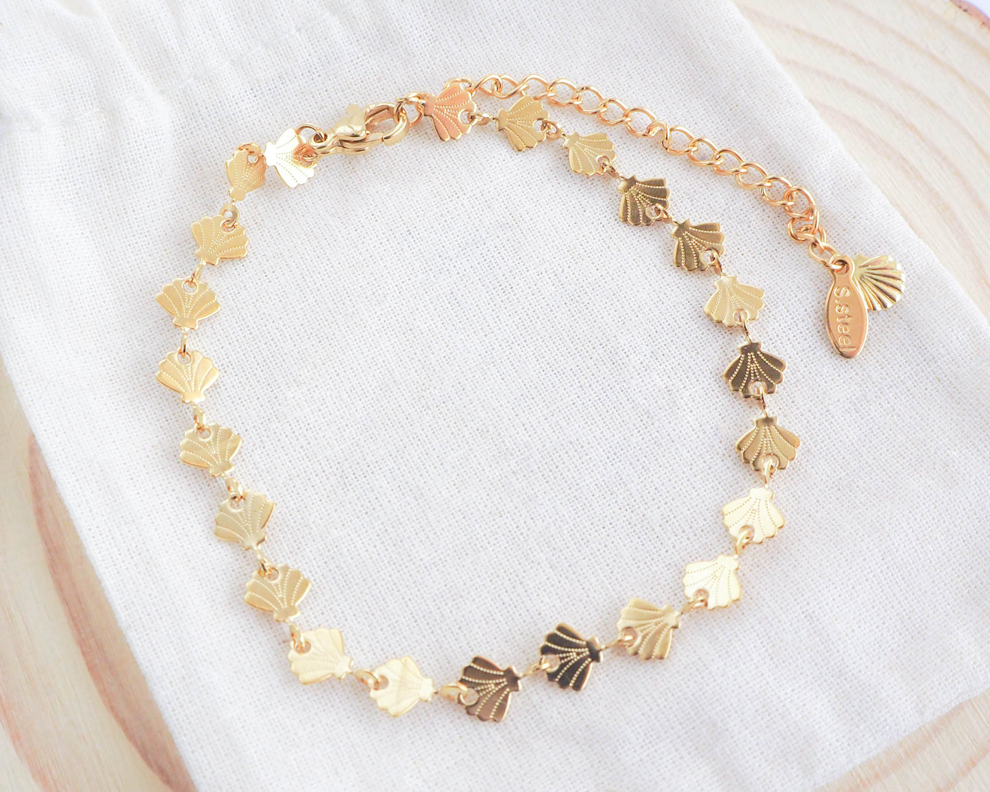 Golden little shell bracelet on display