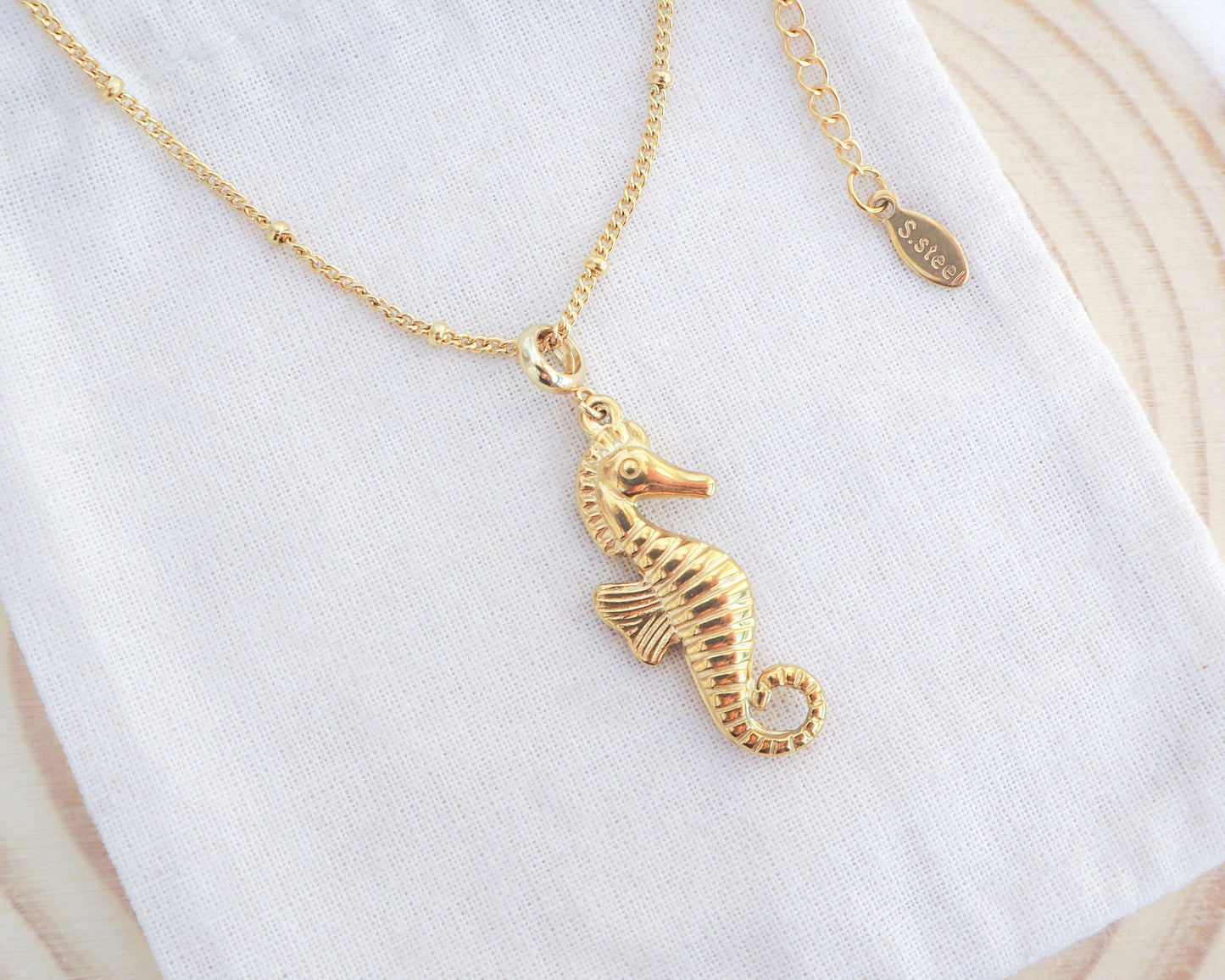 Gold Seahorse Necklace - Hippocampus necklace on display - Ocean-Inspired Jewelry, Sea by Lou, Seabylou