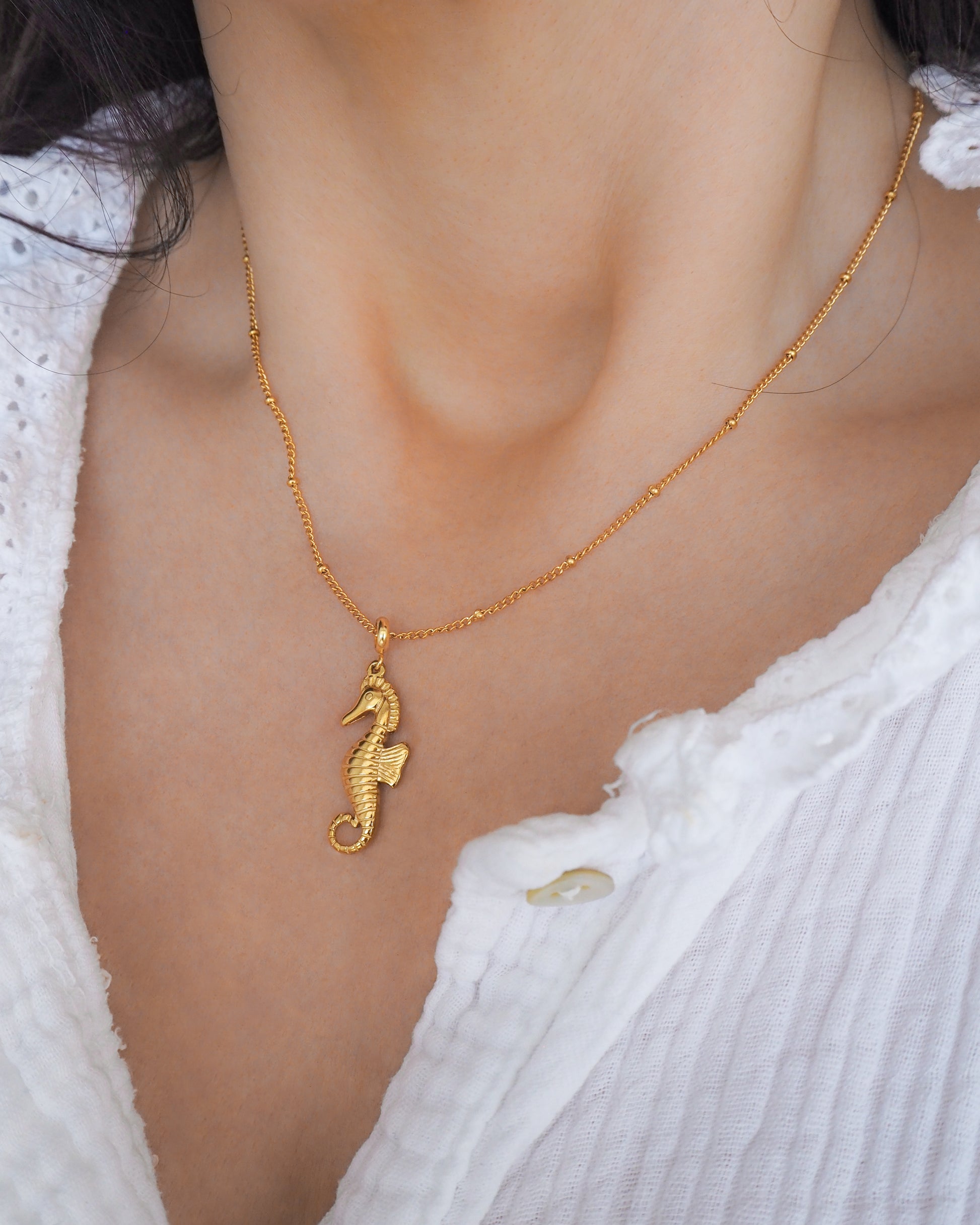 Gold Seahorse Necklace on neck model - Hippocampus necklace - Ocean-Inspired Jewelry, Sea by Lou, Seabylou