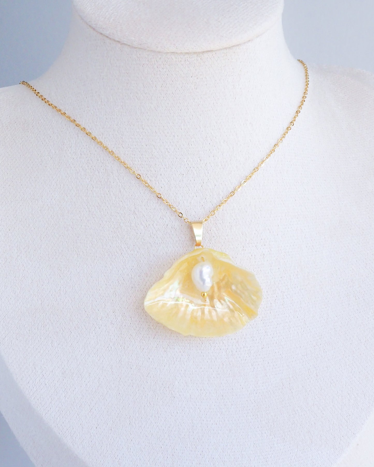 Soft Yellow Jingle Shell Gold Necklace on neck, Mother of Pearl Pendant