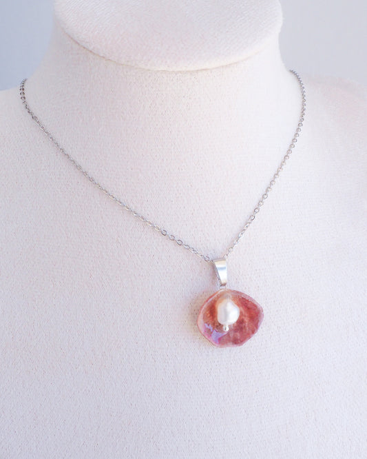Fuchsia Jingle Shell Silver Necklace with freshwater pearl, Mother of Pearl Pendant on display
