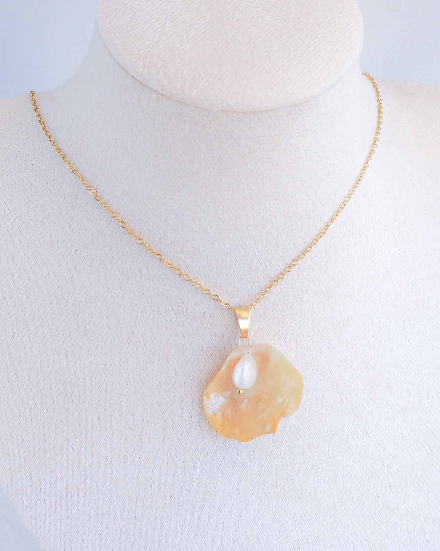 Soft Yellow Jingle Shell VI Gold Necklace on neck, Mother of Pearl Pendant