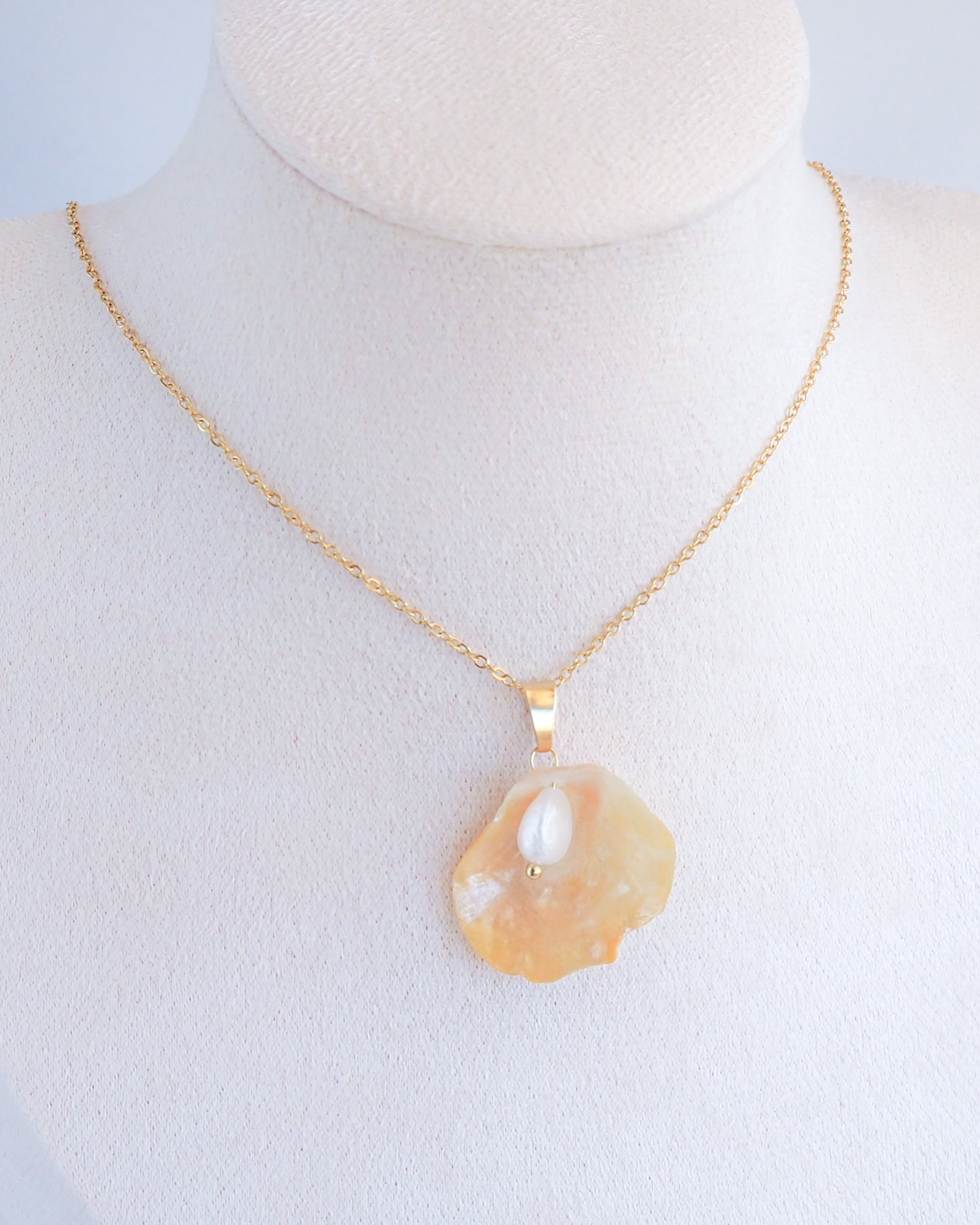 Soft Yellow Jingle Shell VI Gold Necklace on neck, Mother of Pearl Pendant