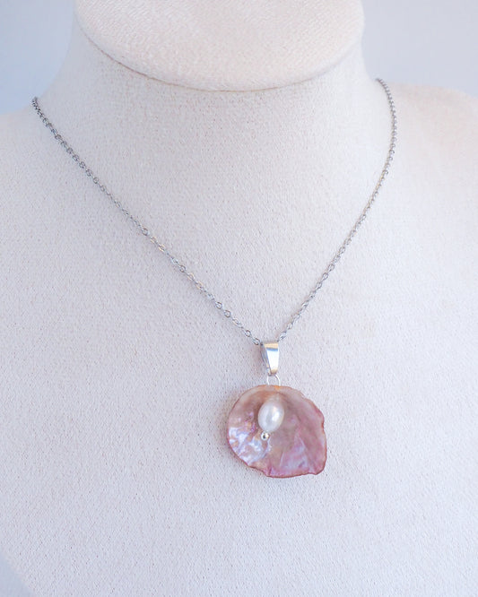Pink Jingle Shell Silver Necklace with Freshwater Pearl on neck