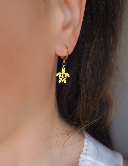 Gold Turtle Hoop Earrings in ear