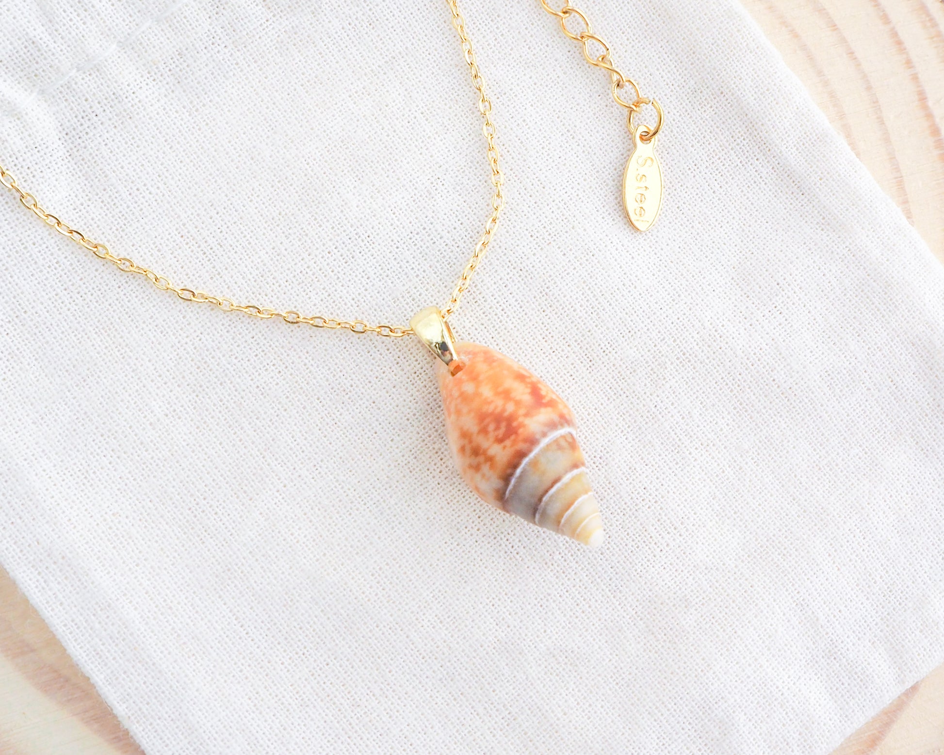 Rustic Dove Shell Gold Necklace on display, Light Rustic Dove Shell from Portugal