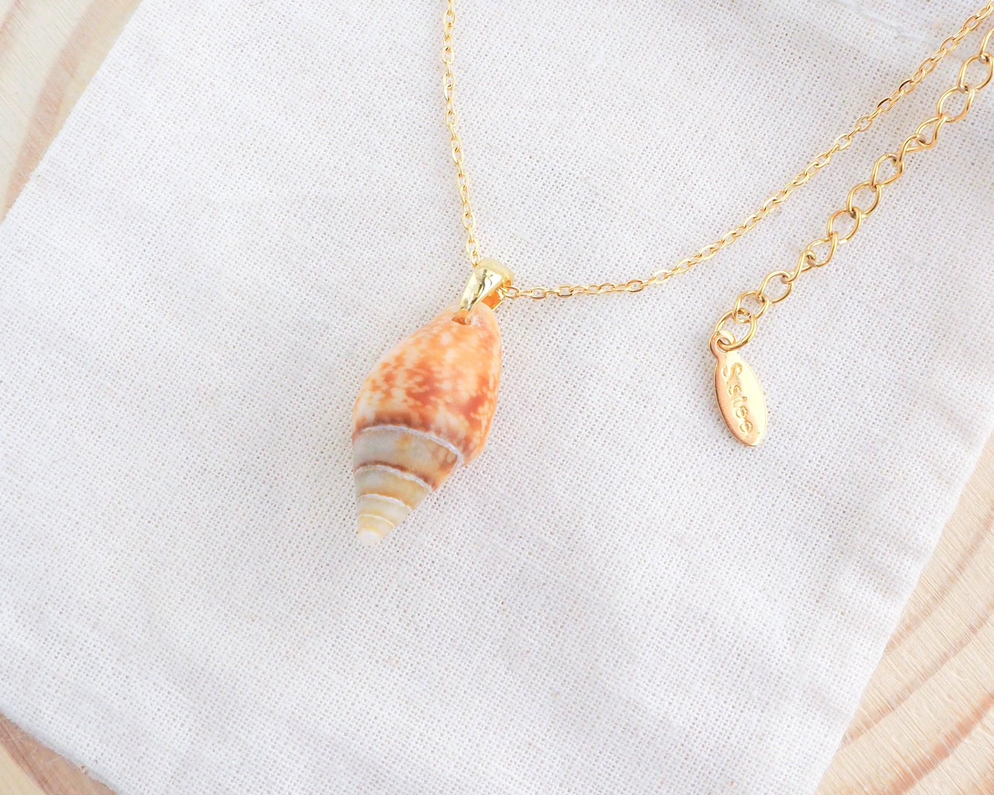 Rustic Dove Shell Gold Necklace on display side view, Light Rustic Dove Shell from Portugal