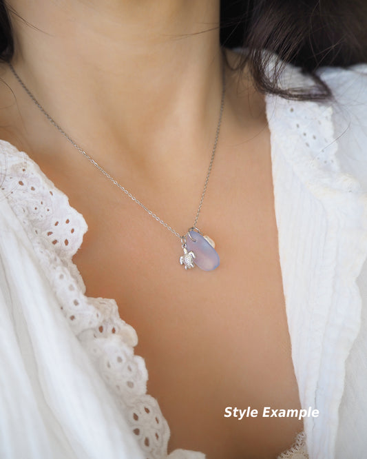 Model wearing Tiny Turtle Blue Sea Glass Pearl Silver Necklace on neck, tiny turtle necklace, ocean blue necklace, coastal jewelry, freshwater pearl necklace, silver turtle necklace