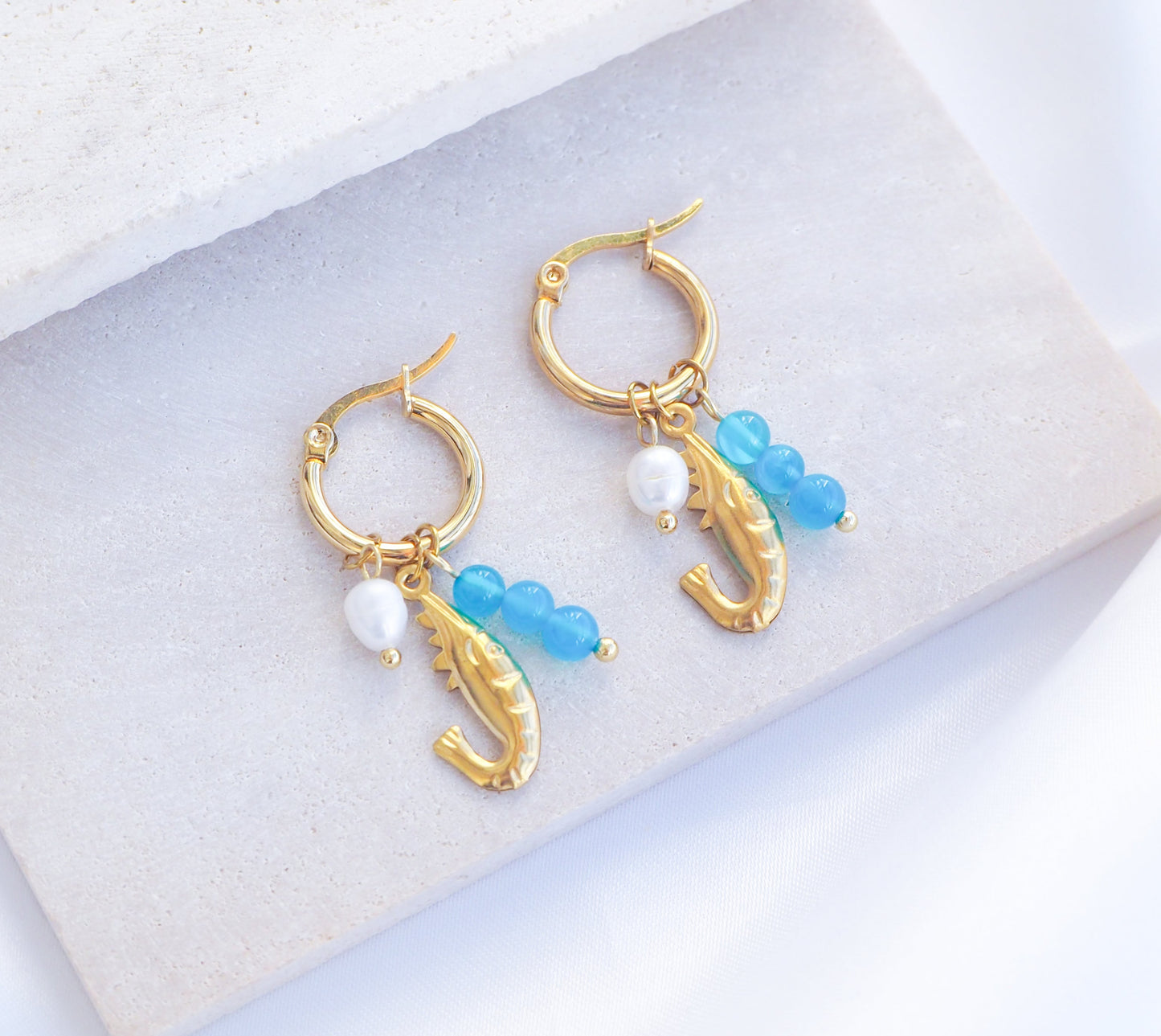 Shrimp Trio Earring Blue Aquamarine Pearl on display